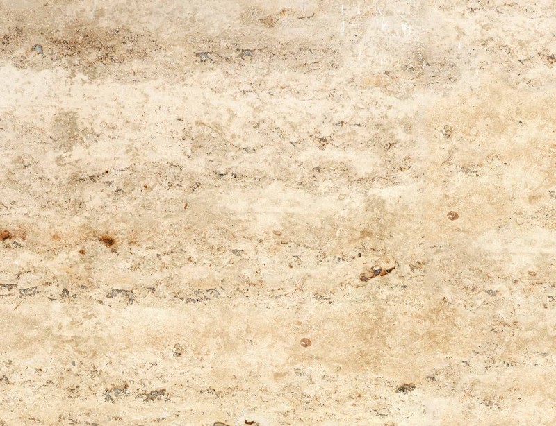 Travertin: Sehr heller bis gelbbrauner Kalkstein, vorzugsweise mit fein geschliffener Oberfläche. Foto: Sto
